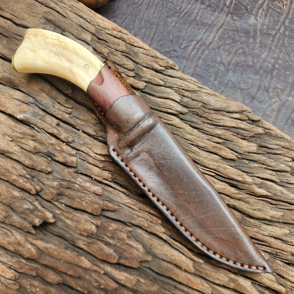 Handcrafted knife with leather scabbard