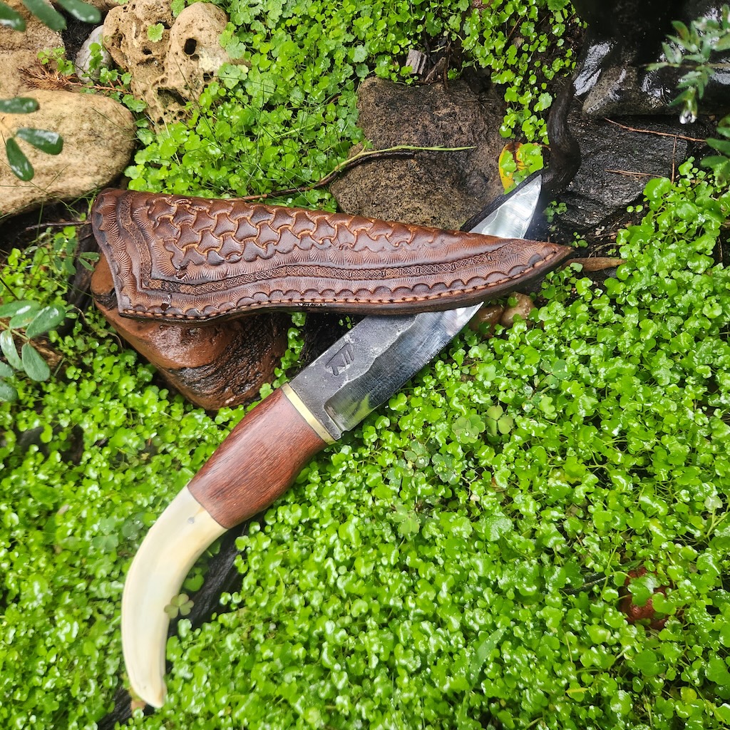 Handcrafted knife and leather sleeve