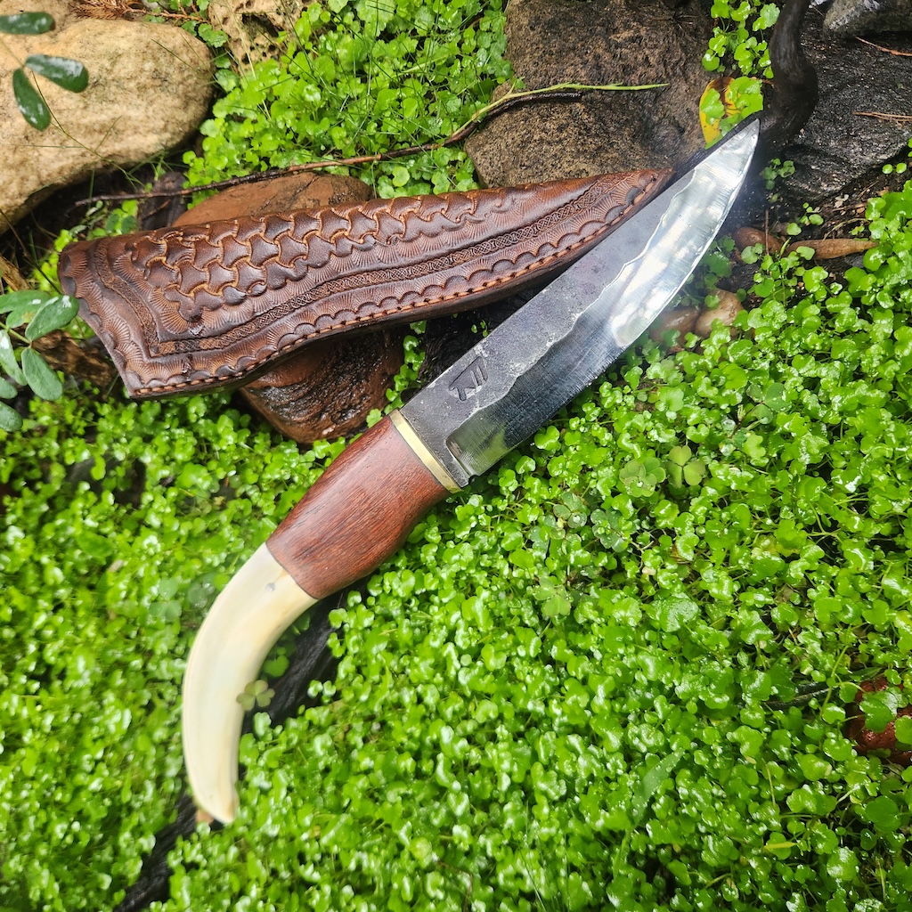 Handcrafted knife with curved handle
