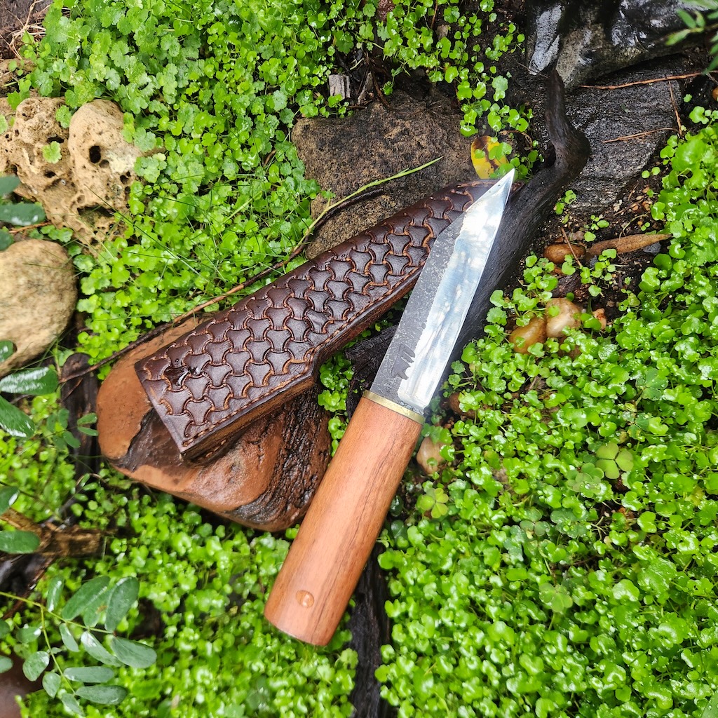small handcrafted knife with leather sheath