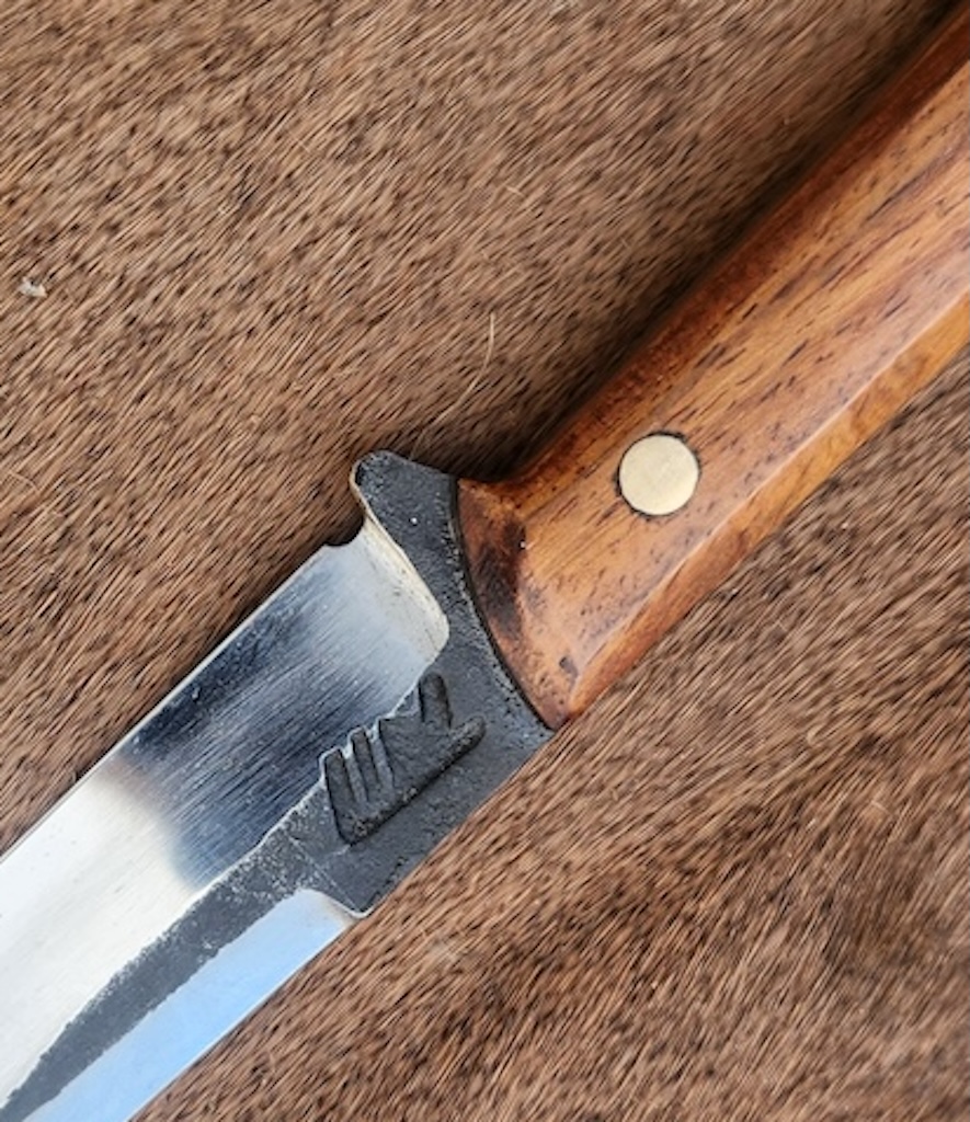 Handcrafted knife with wooden handle close-up