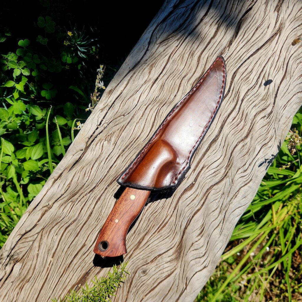 Handcrafted knife in leather cover